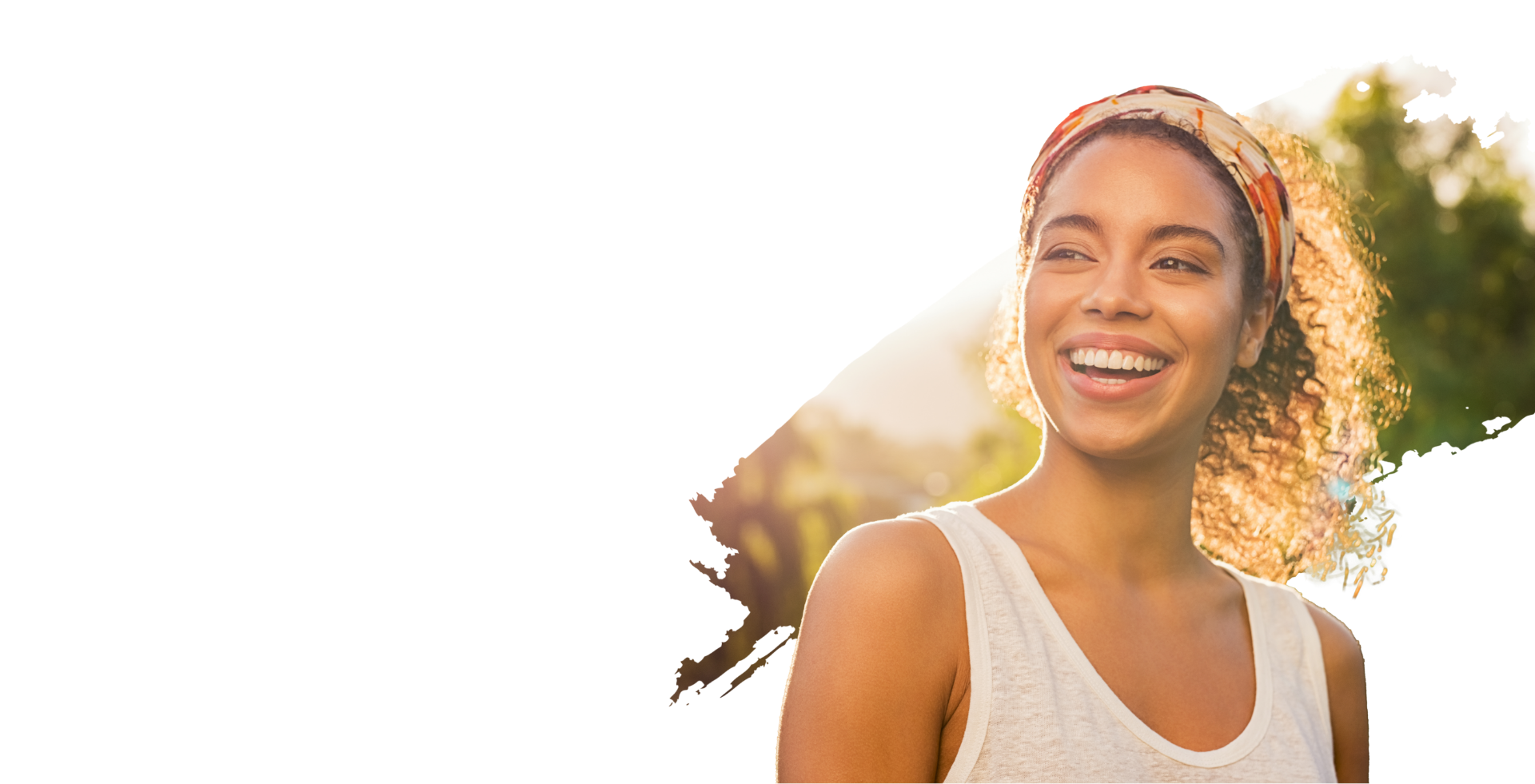 Smiling woman with the sun shining on her hair